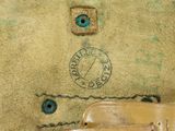 a close up of a piece of leather with a stamp on it