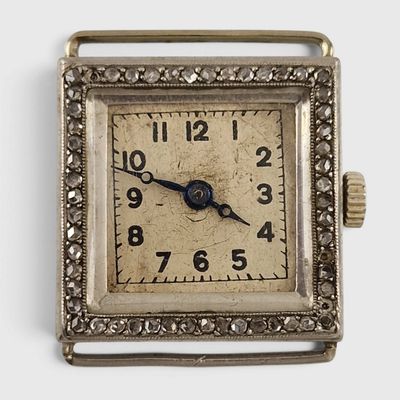 an image of a square silver watch with a diamond bezel