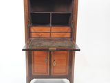 an old wooden cabinet with a marble top and drawers