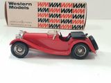 a red model of a car on a white surface