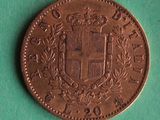 a close up of a coin with a coat of arms on it