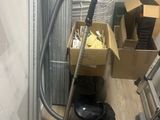 a vacuum that is sitting on the floor next to a box