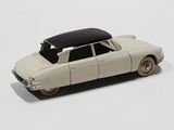 a toy car that is sitting on a white surface