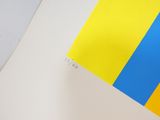 yellow and blue stripes on a piece of paper with a white background