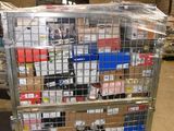 a metal cart with many boxes on it in a warehouse
