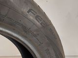 a close up of a tire on a white surface