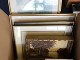 a box full of pictures and a picture frame in it