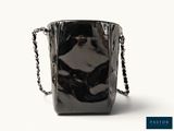 a black bag with a chain around it on a white background