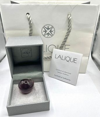 a box with a ring inside of it and a box with a ring inside of it