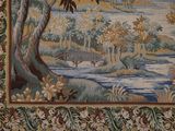 a tapestry with a picture of a river and a bridge
