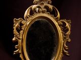a mirror that is sitting on top of a table