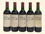 four bottles of wine are lined up in a row