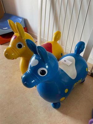 three plastic toy animals that are sitting on the floor
