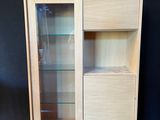 an image of a cabinet with a glass door