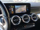 a car dashboard with a dash camera and a steering wheel