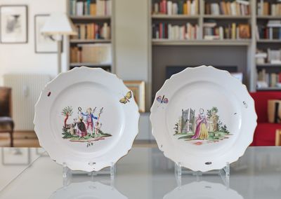 two plates that are sitting on a table