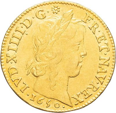 a gold sovereign coin with the head of a woman in profile