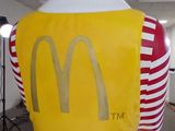 an inflatable statue of a woman wearing a mcdonald ' s costume