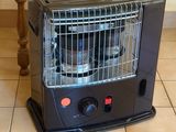 a black heater sitting on a tiled floor next to a chair