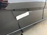 a sticker on the door of a car that has a message on it