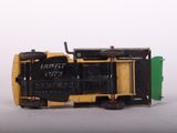 a yellow and black toy train on a white surface