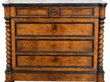an old wooden chest of drawers with marble top