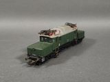 a toy train on a gray surface with a gray background