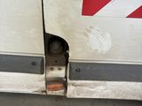 a white van with a red stripe on the side of it
