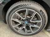 a close up of a tire on a black car