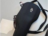 a black bag that is sitting on a table