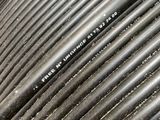a close up picture of a large coil of black wires