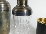 two vases and a glass on the table