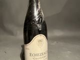 a bottle of wine that is sitting on a table