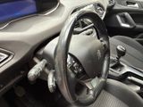 a steering wheel and dashboard of a car in a car showroom