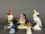 three figurines of birds sitting on top of each other