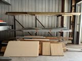 several pieces of wood are stacked on top of each other in a warehouse
