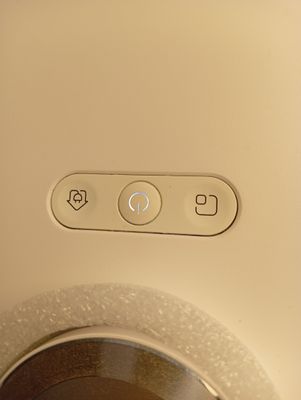 a close up of a button on the side of a toilet