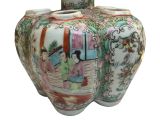 a vase with a picture of a woman and a man on it