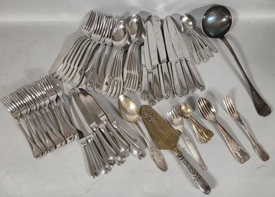 a lot of silver spoons and spoons on the table