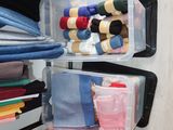 a closet with many different types of clothes in it