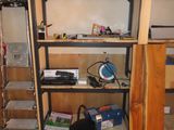 a microwave and a microwave oven on a shelf in a room