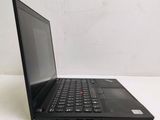 the back of a laptop computer sitting on top of a white table