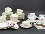 many different types of tea cups and saucers