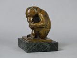 bronze sculpture of a monkey sitting on a marble base