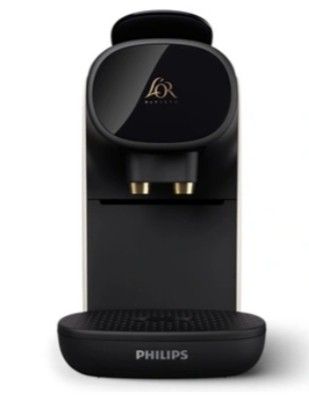the coffee machine is black and has a gold logo on it