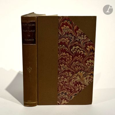 a book that is sitting on a white surface