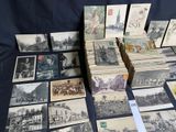 a lot of old postcards sitting on a table