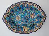 a blue plate with a floral design on it