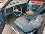 a picture of the interior of a car with the door open