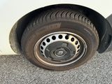 a close up of a tire on a white car